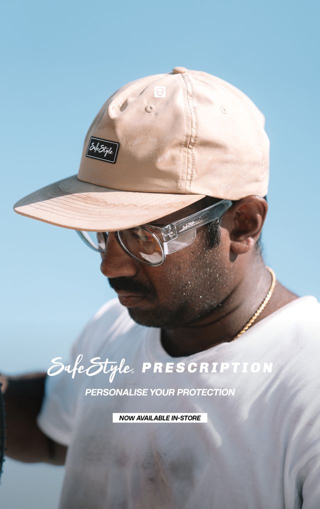 SafeStyle campaign model wearing clear prescription safety glasses with side shields